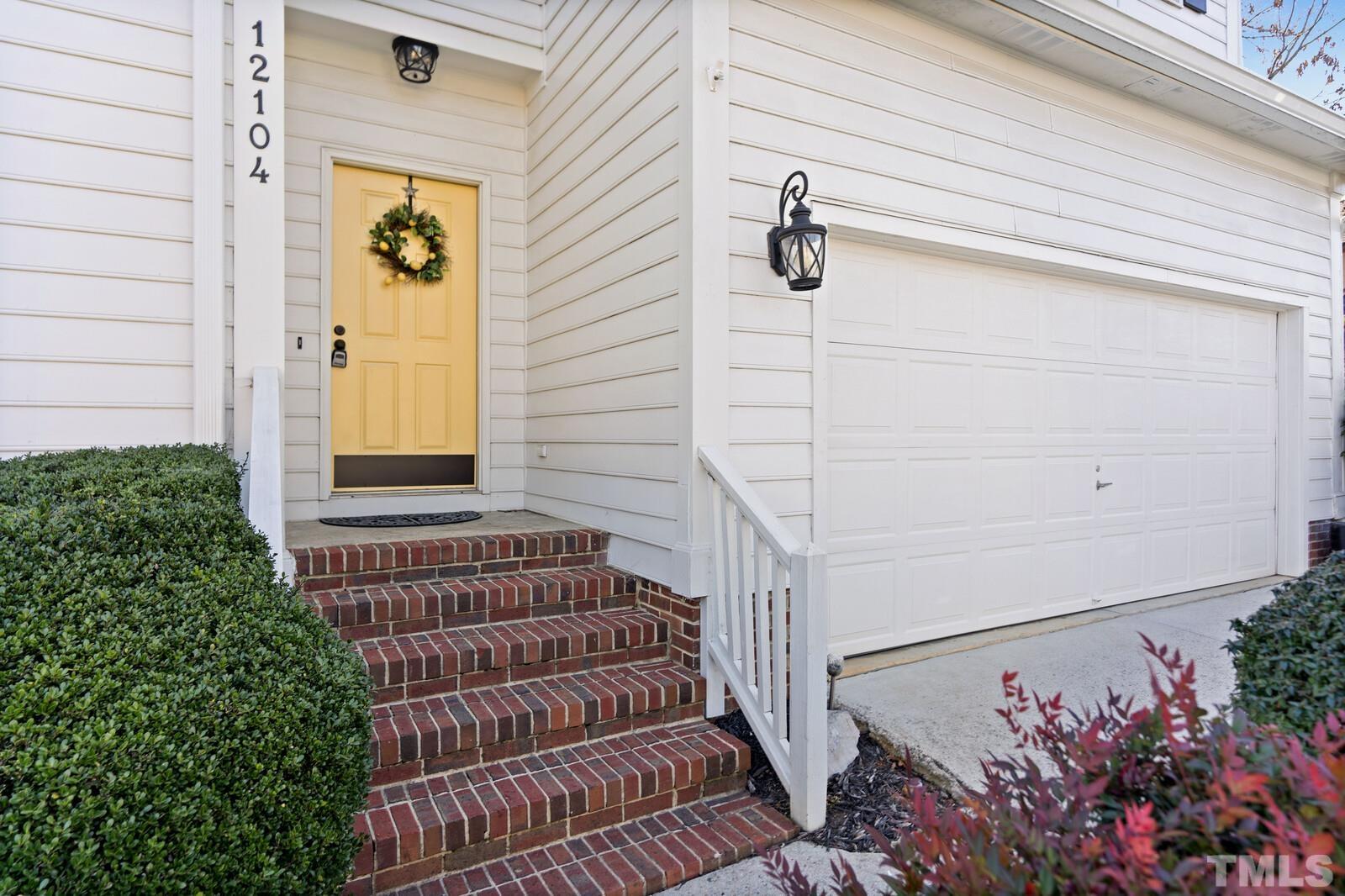 12104 Amoretto Way Raleigh, NC 27613 - Photo 3 of 21 a view of front door and potted plants