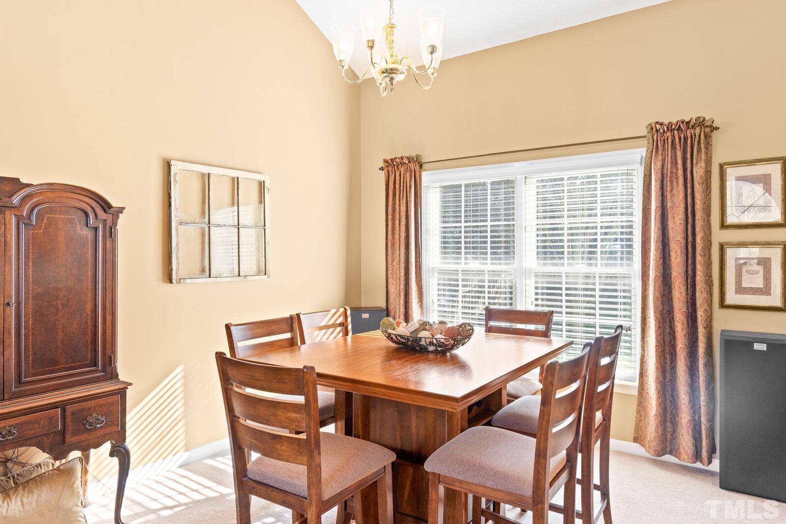 12104 Amoretto Way Raleigh, NC 27613 - Photo 6 of 21 a view of a dining room with furniture and window