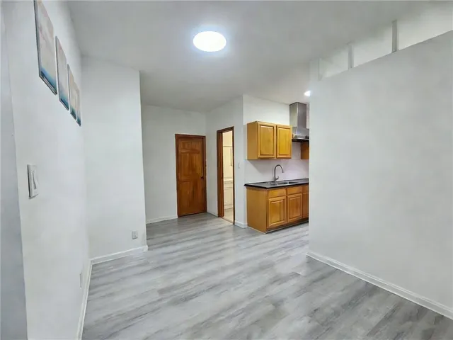 a bedroom with a bed and a sink