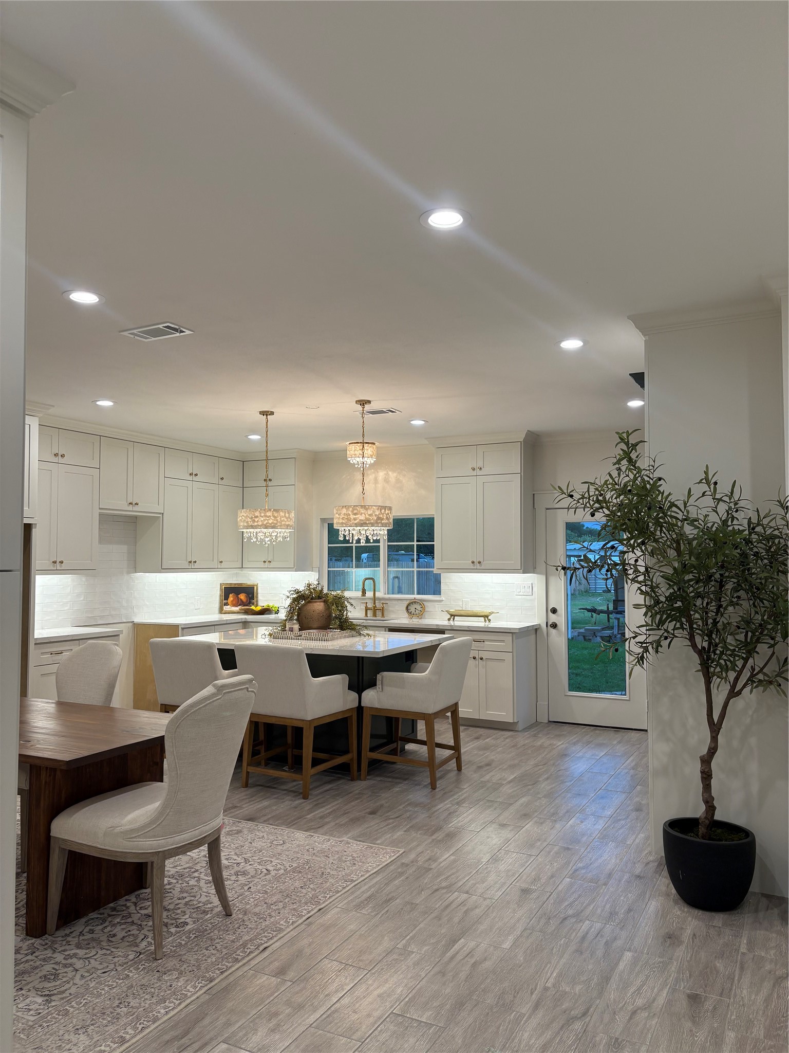 407 Harris Road Highlands, TX 77562 - Photo 12 of 32 a view of a dining room with furniture and chandelier