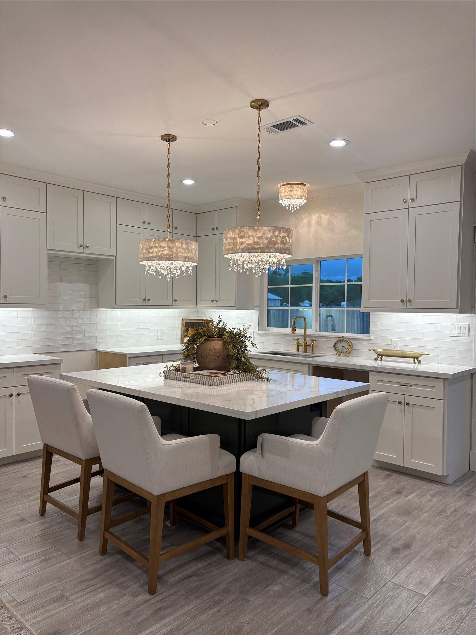 407 Harris Road Highlands, TX 77562 - Photo 13 of 32 a kitchen with a table chairs sink and cabinets