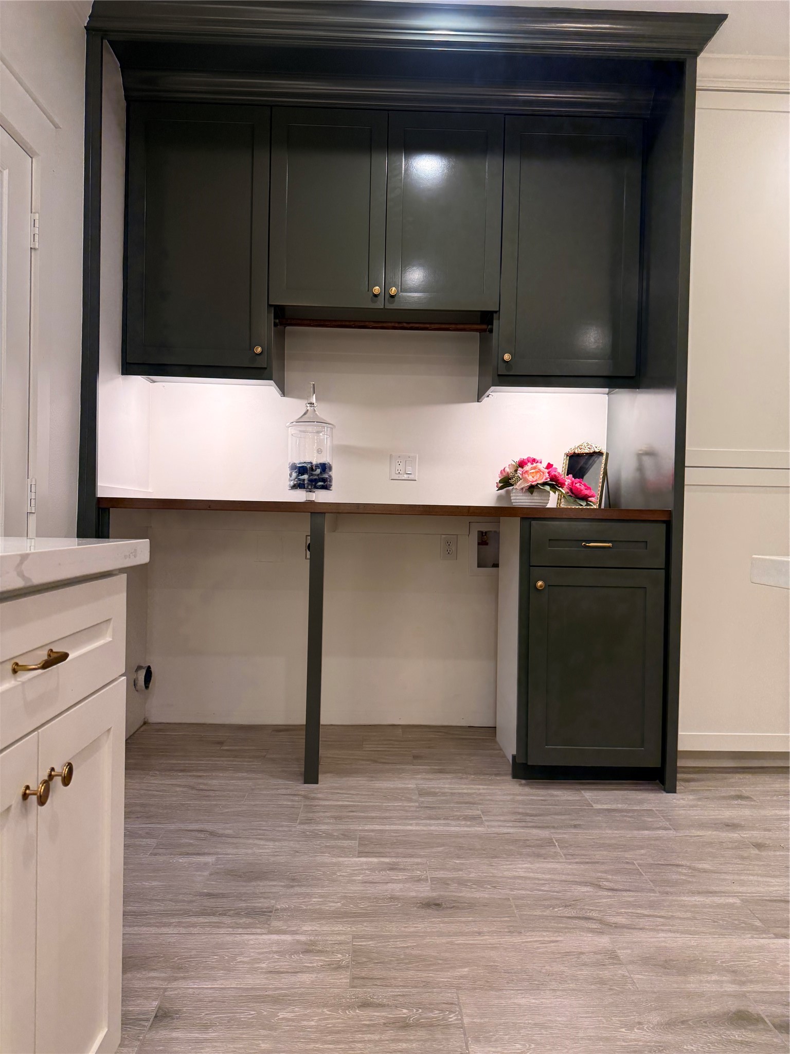 407 Harris Road Highlands, TX 77562 - Photo 17 of 32 a kitchen with a cabinets and wooden floor
