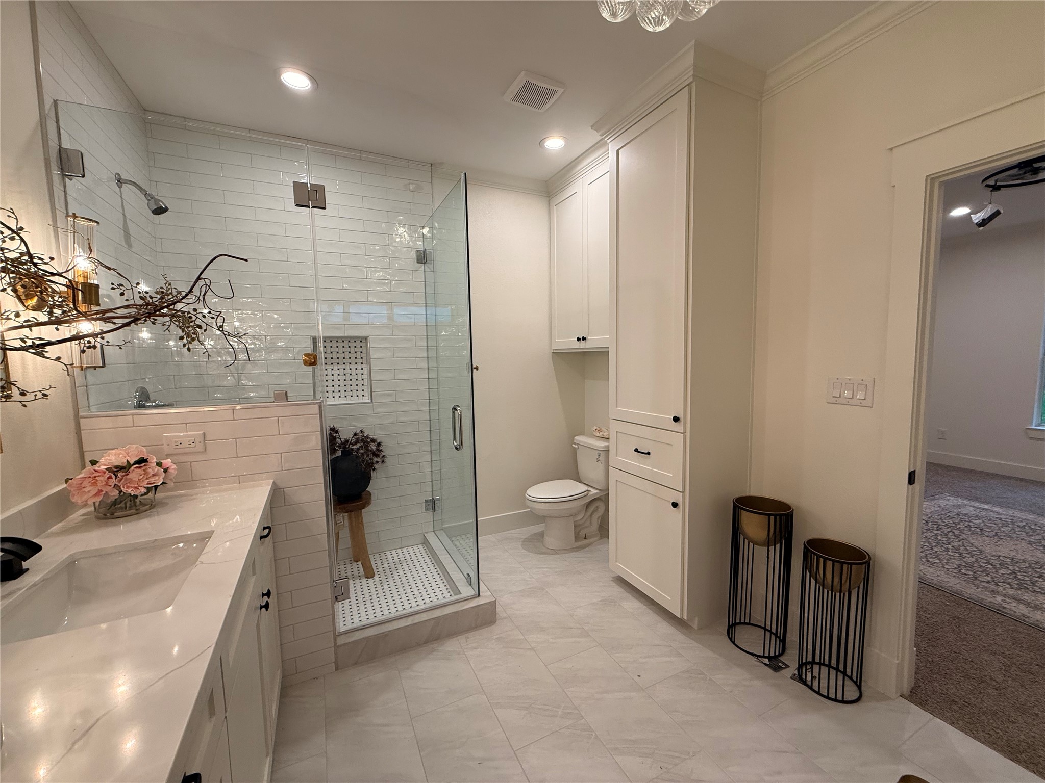407 Harris Road Highlands, TX 77562 - Photo 21 of 32 a bathroom with a double vanity sink toilet and shower
