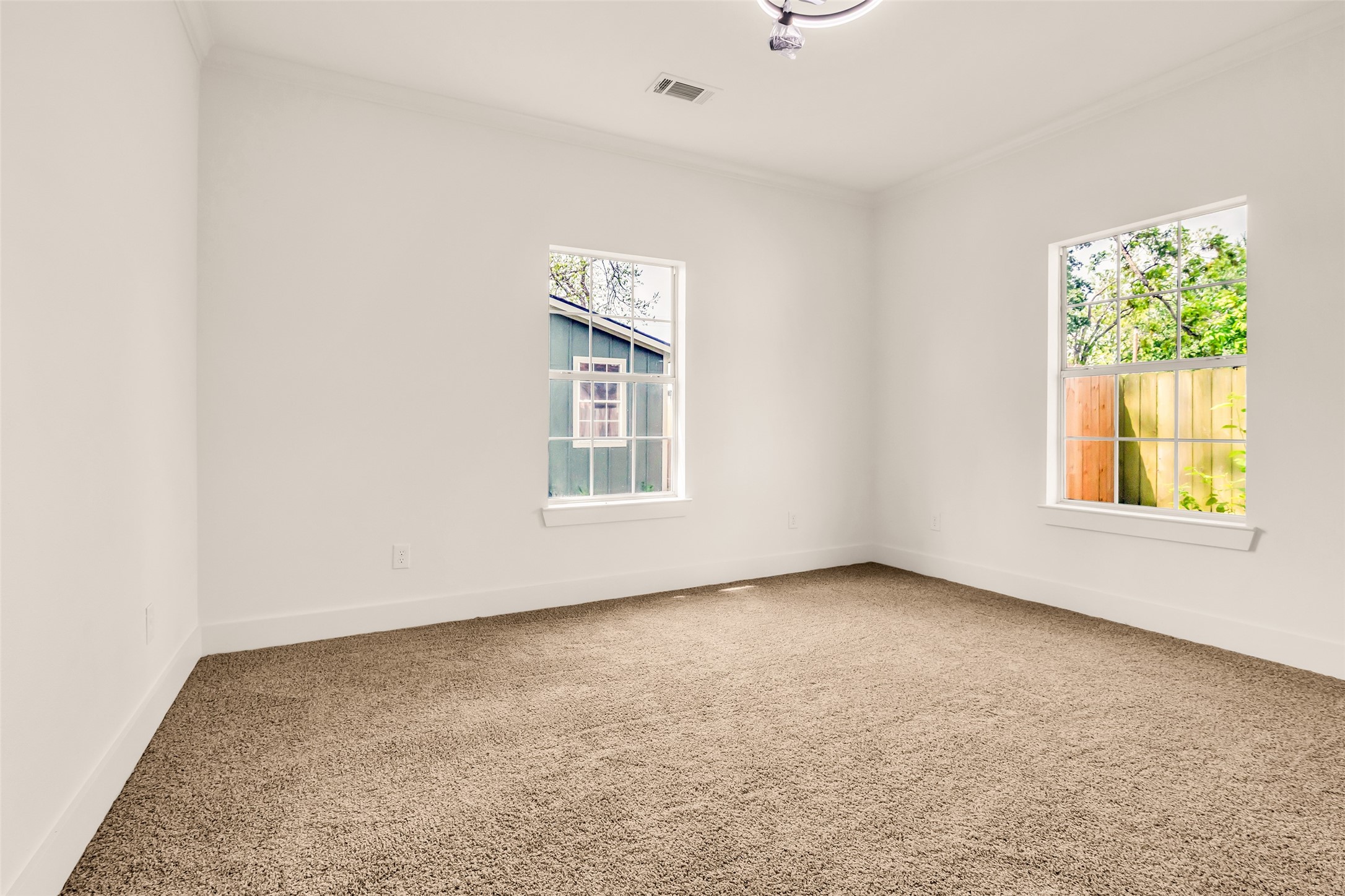 407 Harris Road Highlands, TX 77562 - Photo 28 of 32 an empty room with windows