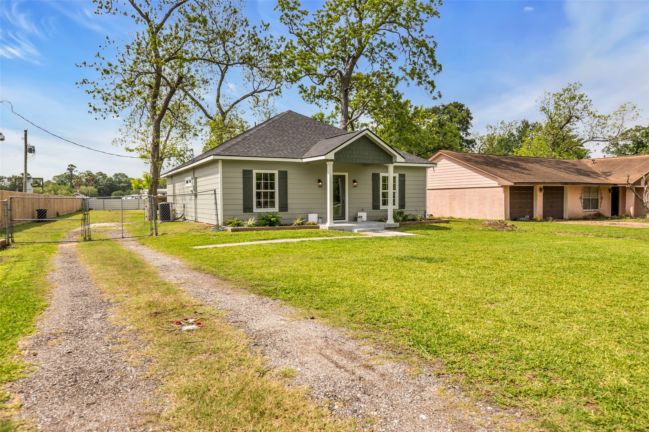 407 Harris Road Highlands, TX 77562 - Photo 3 of 32 a front view of a house with a yard