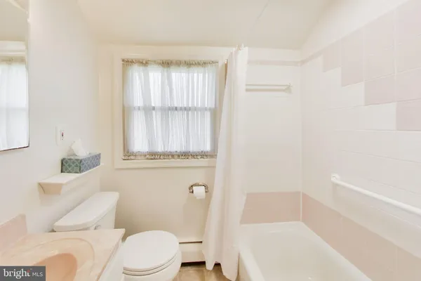 an empty room with a empty space and windows