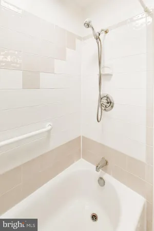 a bathroom with a sink a mirror and shower