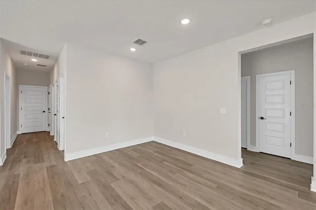 a view of an empty room with a window