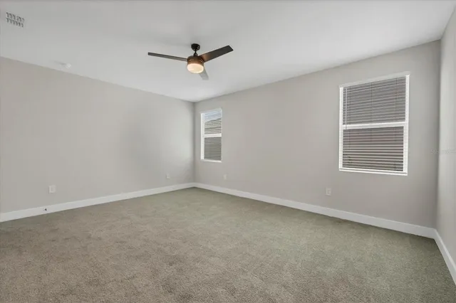 a bathroom with a shower and a window