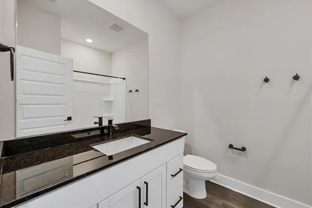 a view of an empty room with a fireplace