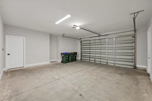 a view of backyard with tub and wooden fence
