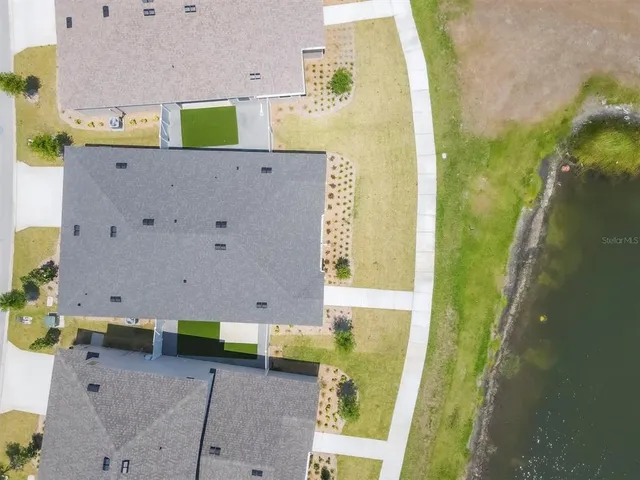 a front view of a residential apartment building with a yard