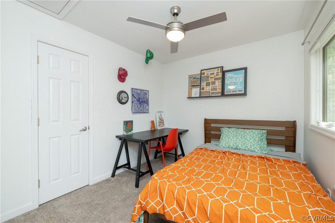 4330 Waumsetta Road Richmond, VA 23235 - Photo 21 of 35 a bedroom with a bed and a table in it