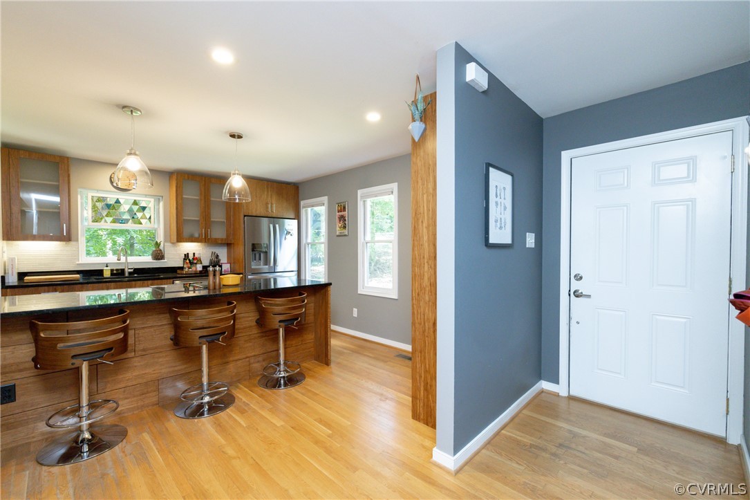 4330 Waumsetta Road Richmond, VA 23235 - Photo 4 of 35 a room with lots of chairs and mirrors