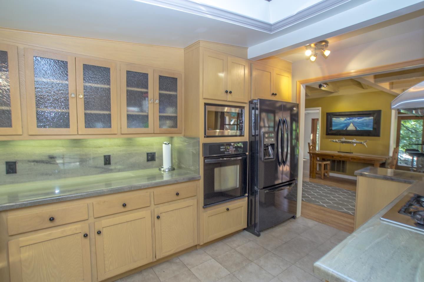 215 Chapman Road Woodside, CA 94062 - Photo 6 of 22 a kitchen with stainless steel appliances granite countertop a refrigerator and a sink