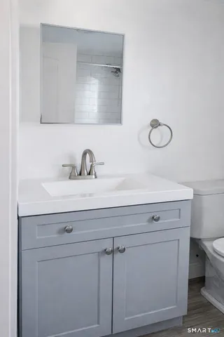 a bathroom with a sink and a mirror
