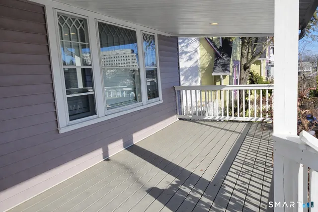 a view of a balcony with furniture