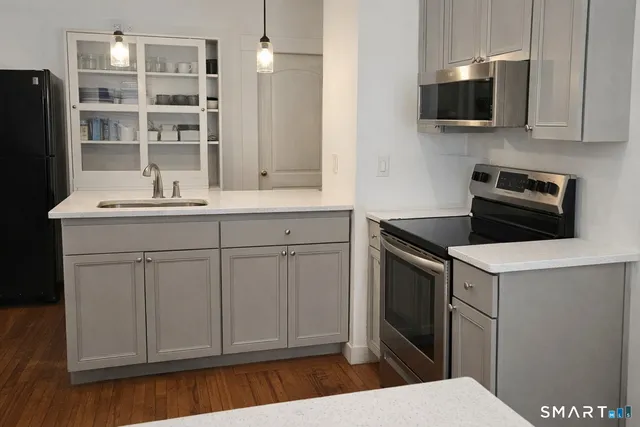 a kitchen with a sink and a microwave