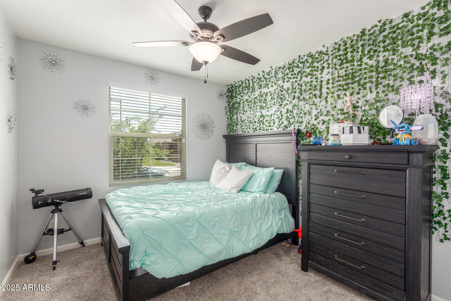 4136 West Palace Station Road New River, AZ 85087 - Photo 11 of 19 a bedroom with a bed and a table in it