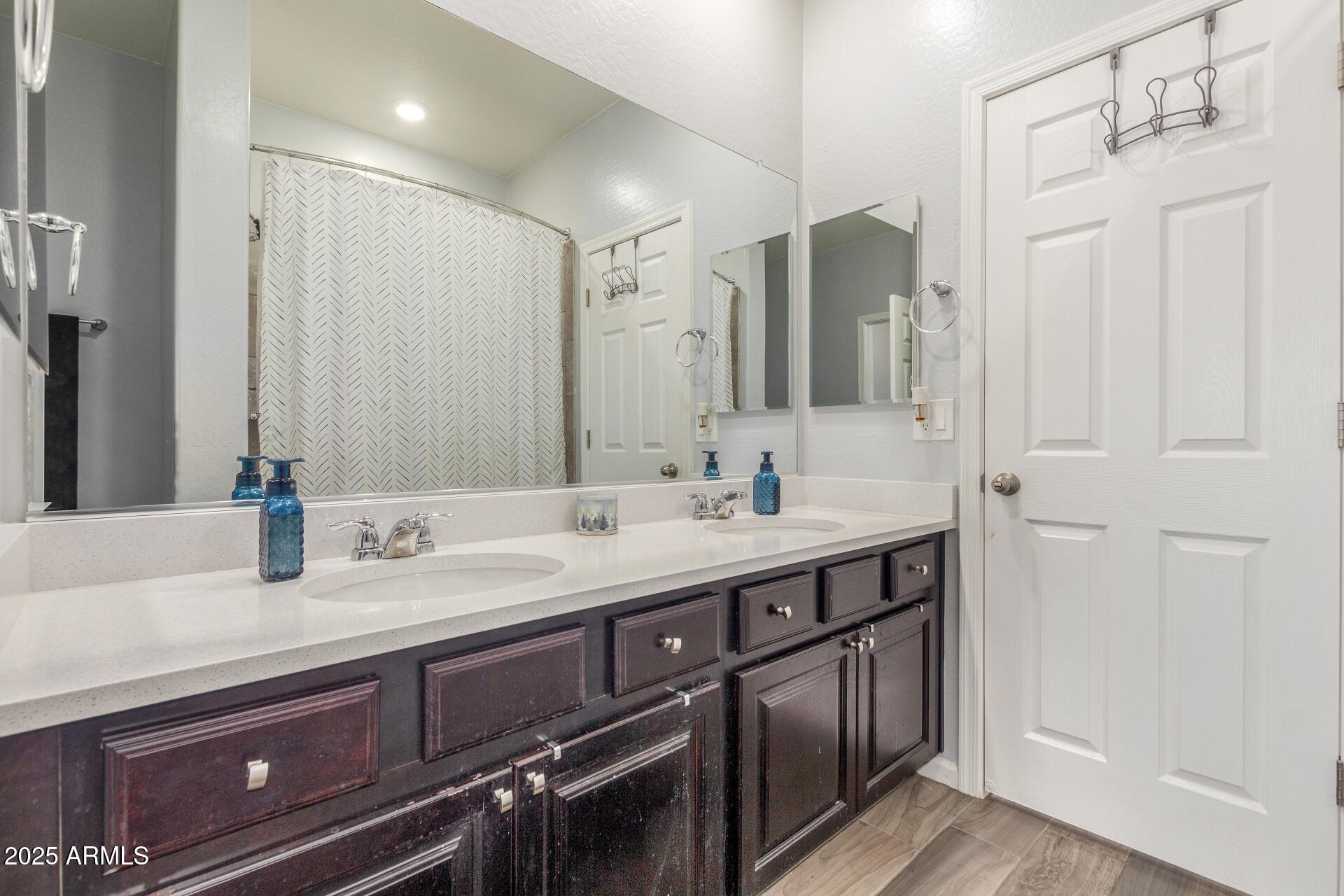 4136 West Palace Station Road New River, AZ 85087 - Photo 12 of 19 a bathroom with double vanity sinks and a mirror