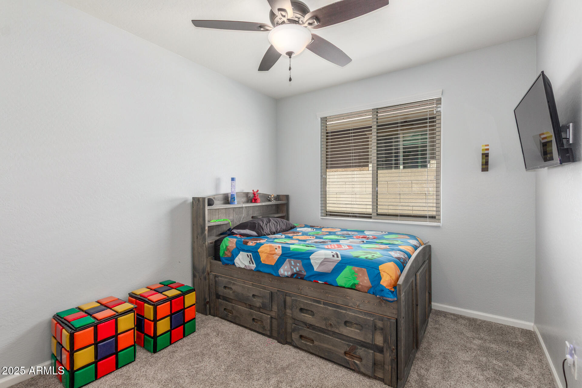 4136 West Palace Station Road New River, AZ 85087 - Photo 10 of 19 a bedroom with a bed and a baby bed with dresser
