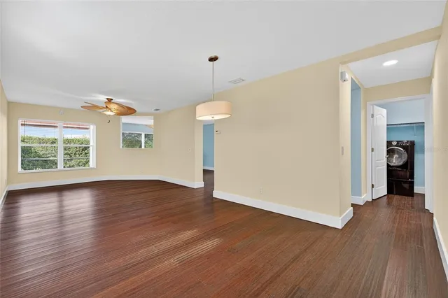 a bathroom with double vanity sinks and a mirror