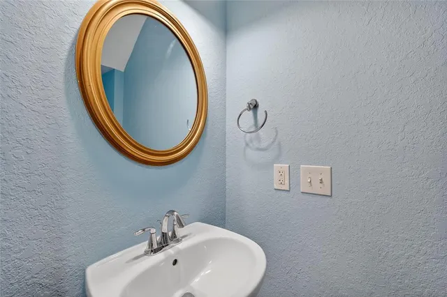 a view of an empty room with a ceiling fan