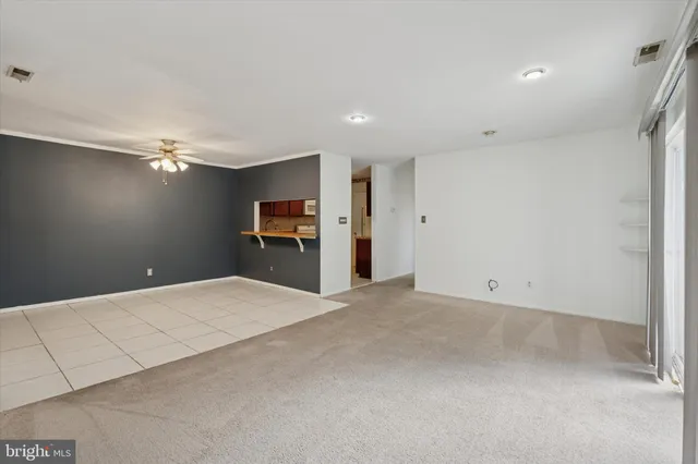 a view of a livingroom with a kitchen