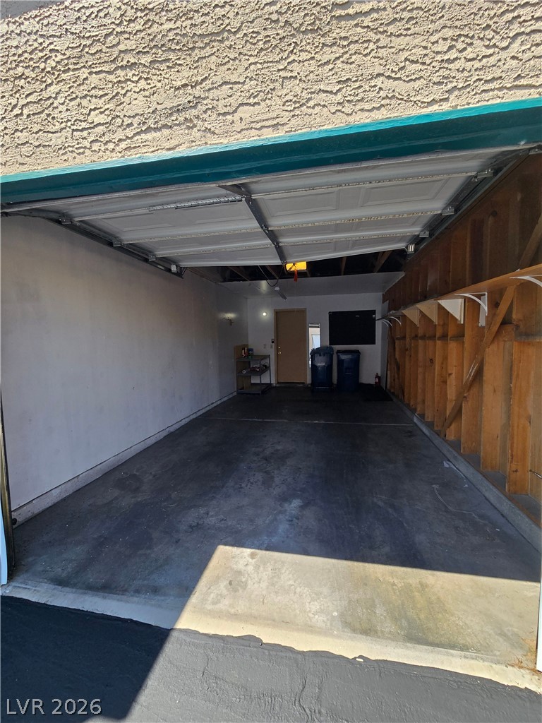 6750 Del Rey Avenue, Unit 133 Las Vegas, NV 89146 - Photo 31 of 34 Functional garage with ample space for parking and storage.