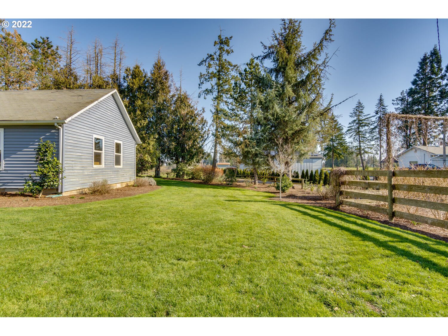 18876 Butteville Road Northeast Aurora, OR 97002 - Photo 17 of 32 a view of an house with backyard space and garden