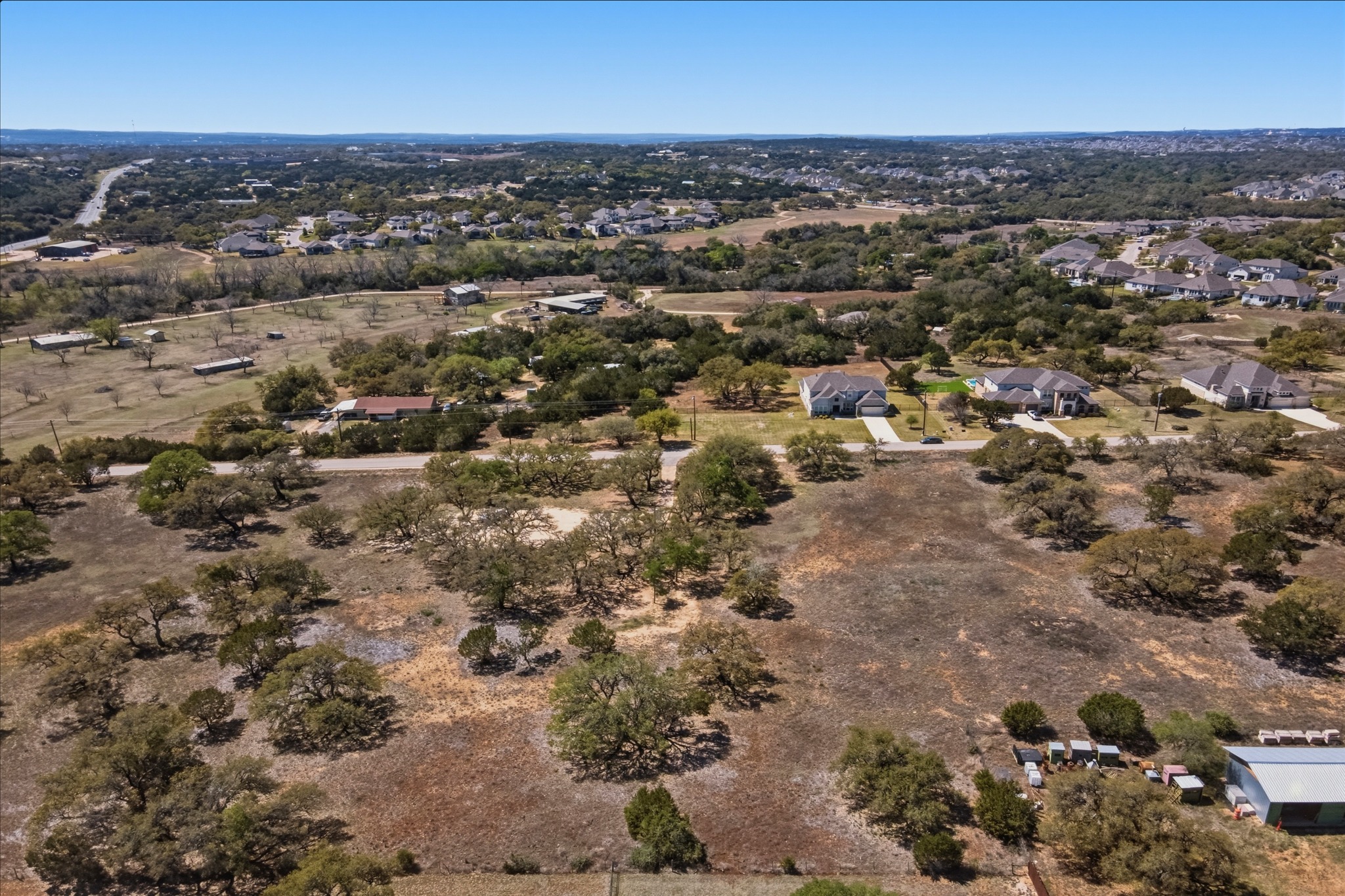 268 Kinnikinik Loop Austin, TX 78737 - Photo 11 of 32 an aerial view of multiple house