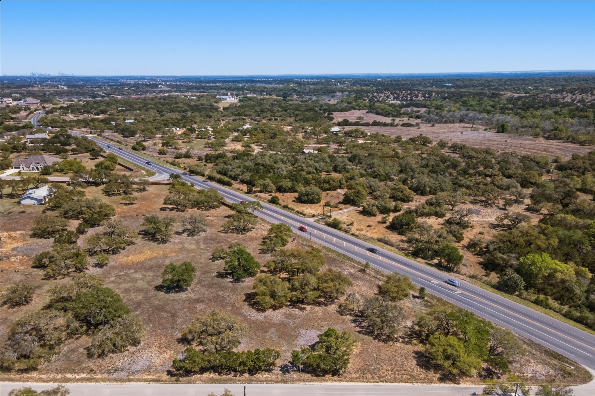 268 Kinnikinik Loop Austin, TX 78737 - Photo 10 of 32 an aerial view of residential houses with outdoor space