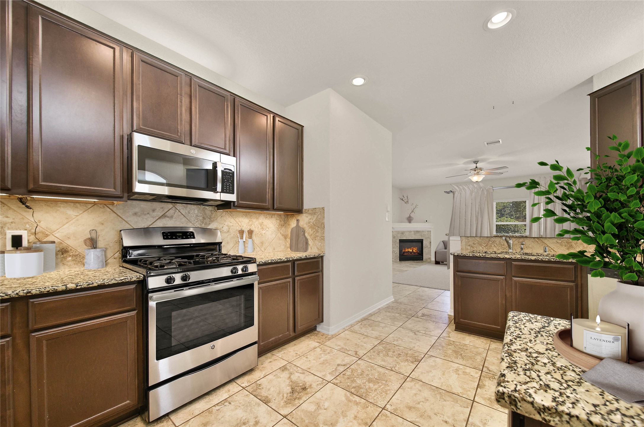 2672 Magnolia Fair Way Spring, TX 77386 - Photo 8 of 49 The gas range and functional layout make this space easy to use, even with multiple cooks in the kitchen.