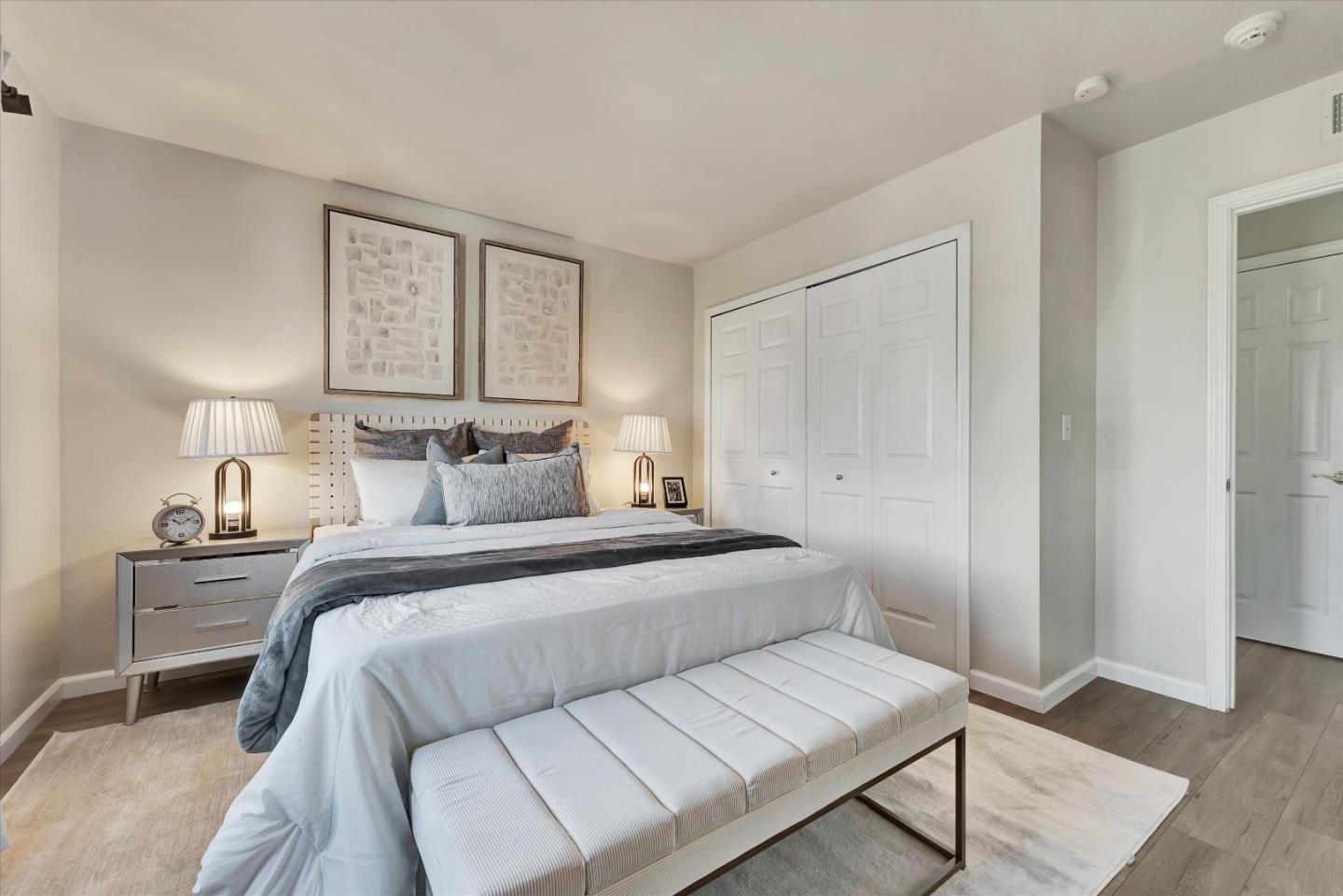 231 Watson Drive, Unit 4 Campbell, CA 95008 - Photo 11 of 16 a bedroom with a bed and a night stand