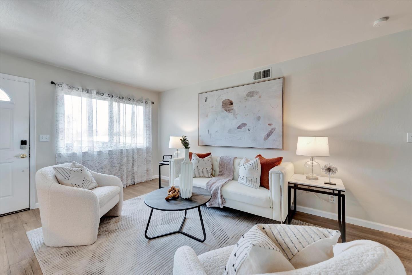 231 Watson Drive, Unit 4 Campbell, CA 95008 - Photo 2 of 16 a living room with furniture and a large window