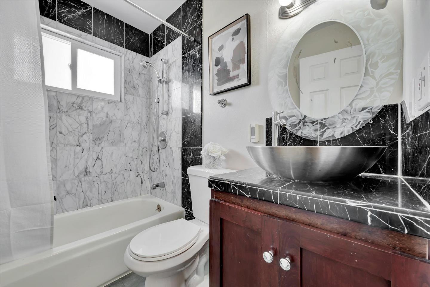 231 Watson Drive, Unit 4 Campbell, CA 95008 - Photo 3 of 16 a bathroom with a granite countertop sink a toilet and bathtub