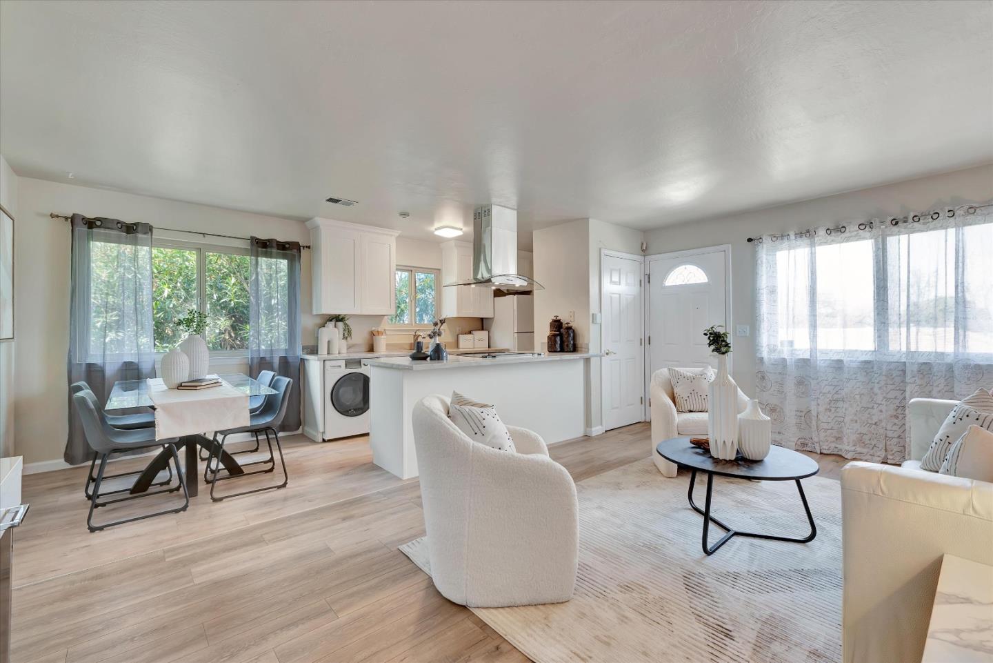 231 Watson Drive, Unit 4 Campbell, CA 95008 - Photo 4 of 16 a living room with furniture a large window and wooden floor