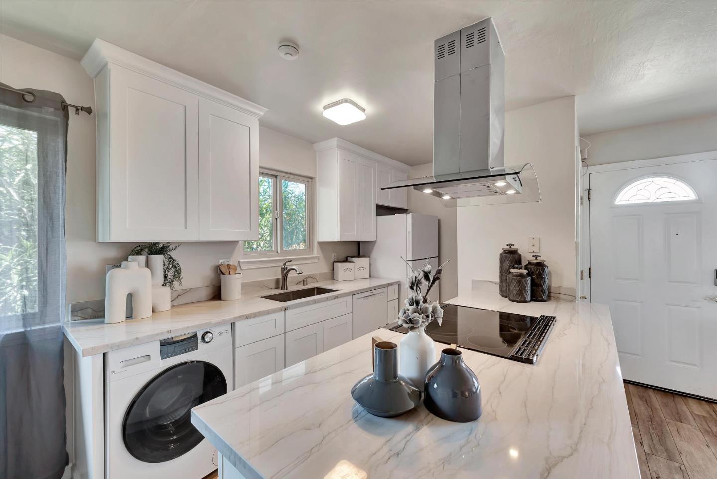 231 Watson Drive, Unit 4 Campbell, CA 95008 - Photo 6 of 16 a kitchen with sink a stove and cabinets