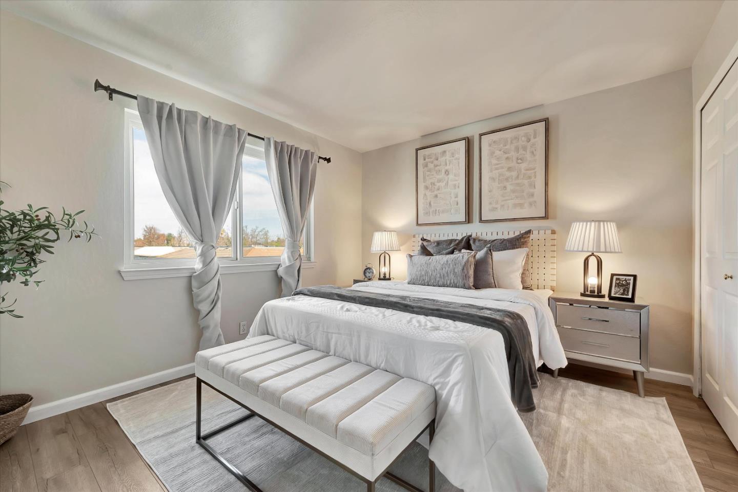 231 Watson Drive, Unit 4 Campbell, CA 95008 - Photo 10 of 16 a bedroom with a bed and a window