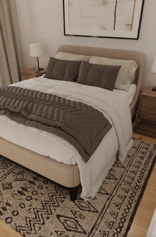 272 Talbot Avenue, Unit 203 Boston, MA 02124 - Photo 3 of 12 a bedroom with a bed and mirror