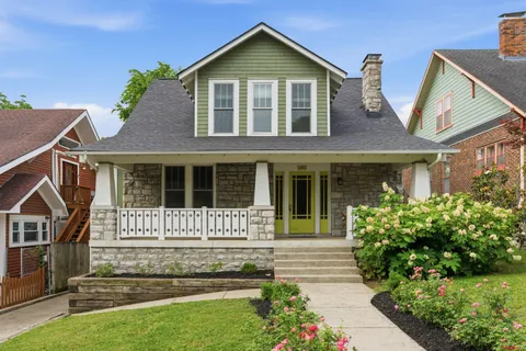a front view of a house with garden