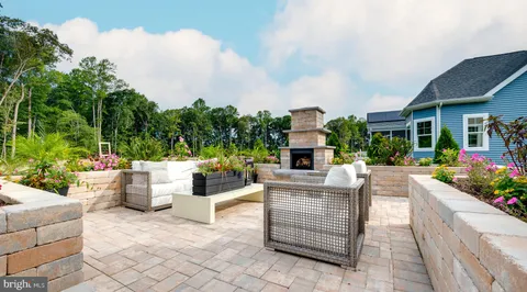 a building outdoor space with patio furniture and potted plants