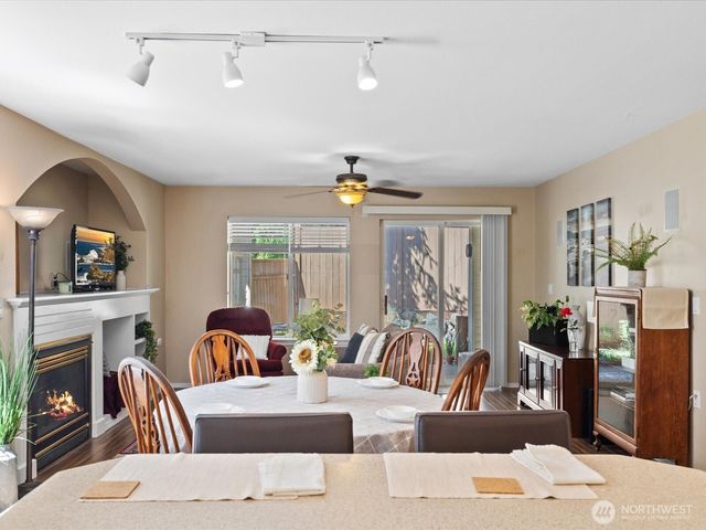 a living room with fireplace furniture and a flat screen tv
