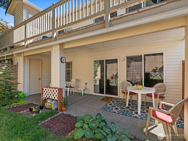 a outdoor dining space with furniture and garden view