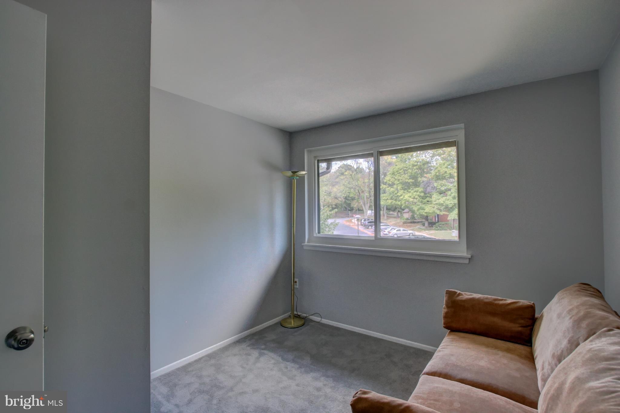 7068 Winter Rose Path Columbia, MD 21045 - Photo 17 of 30 a living room with furniture and a window
