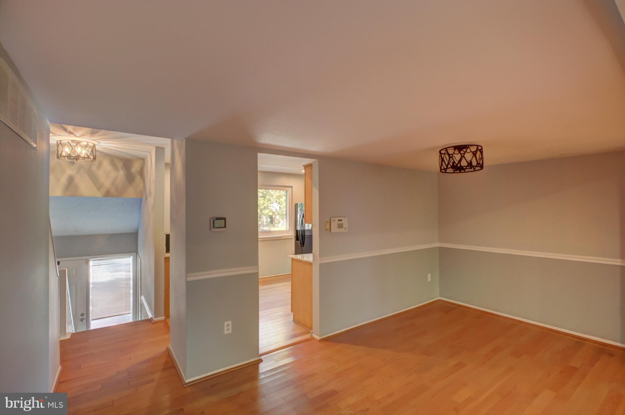 7068 Winter Rose Path Columbia, MD 21045 - Photo 5 of 30 wooden floor in an empty room