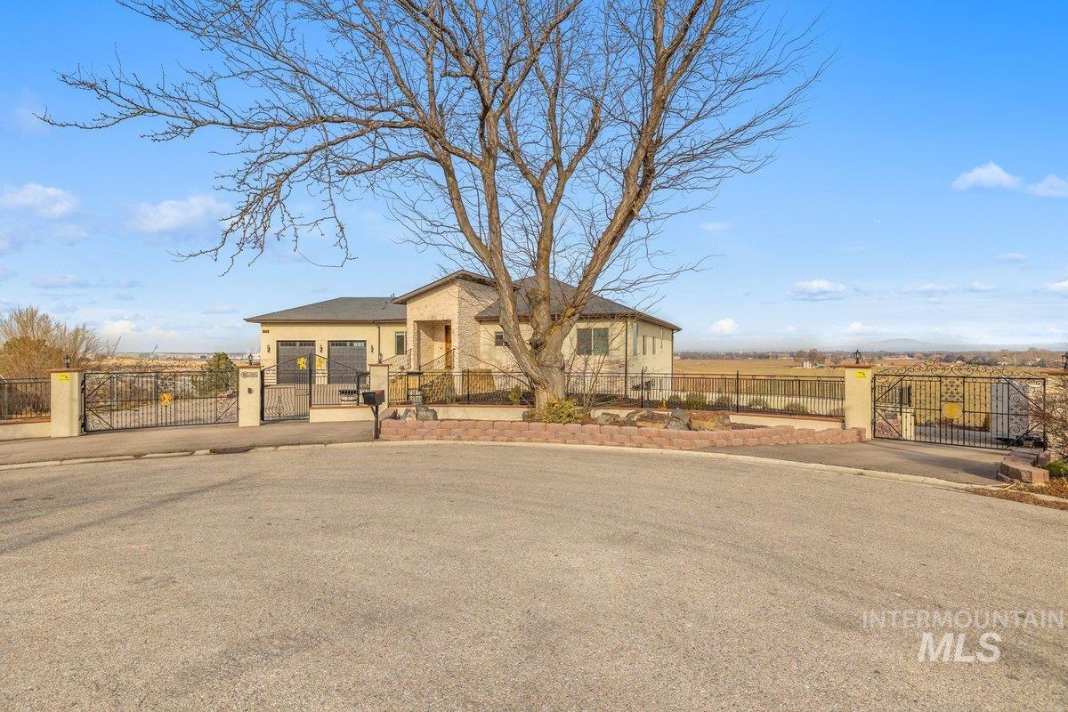 5990 West View Drive Meridian, ID 83642 - Photo 2 of 50 View of front of house featuring a gate and a fenced front yard