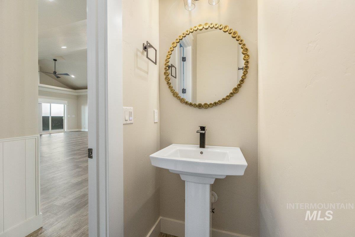 5990 West View Drive Meridian, ID 83642 - Photo 25 of 50 Bathroom featuring wood finished floors, a ceiling fan, lofted ceiling, and recessed lighting