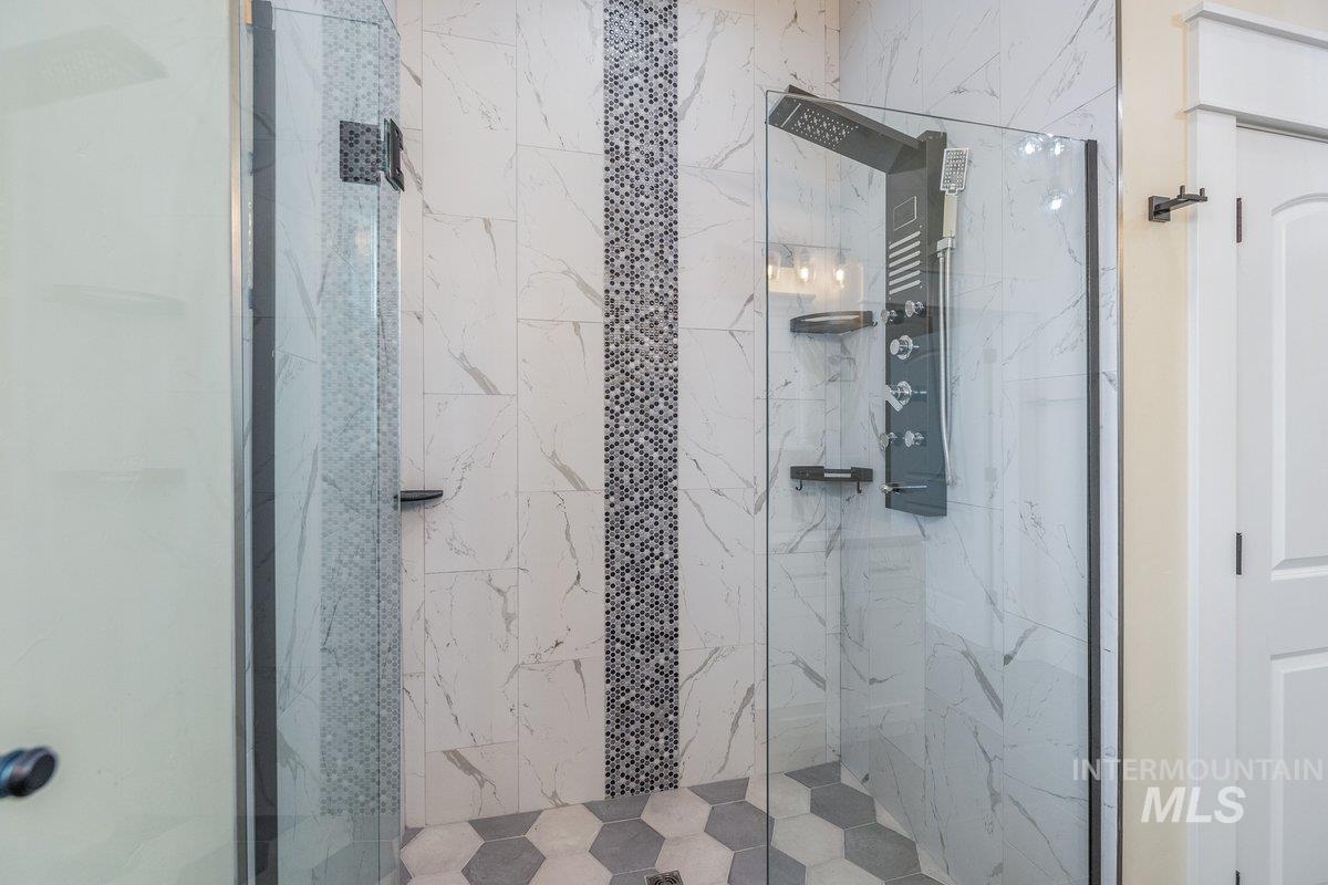 5990 West View Drive Meridian, ID 83642 - Photo 31 of 50 Bathroom featuring a marble finish shower