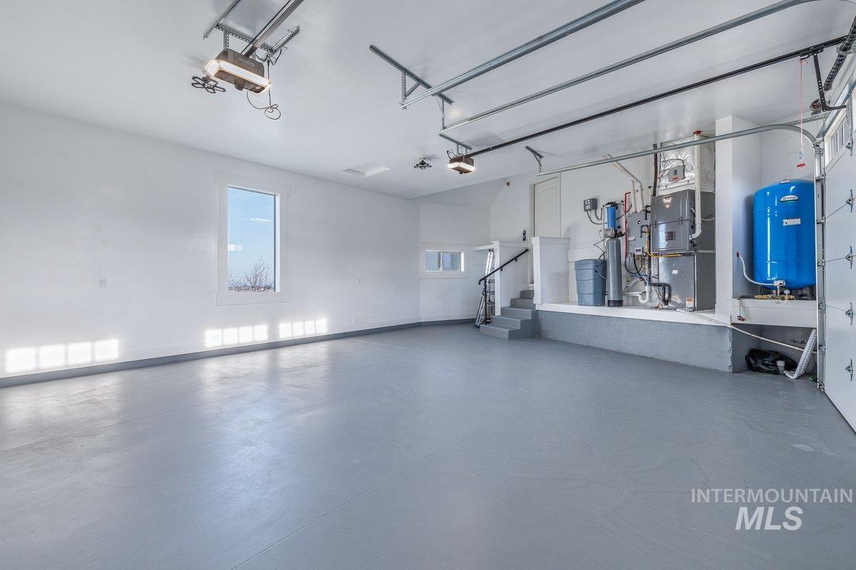5990 West View Drive Meridian, ID 83642 - Photo 38 of 50 Garage featuring heating unit and a garage door opener